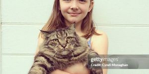 child with cat